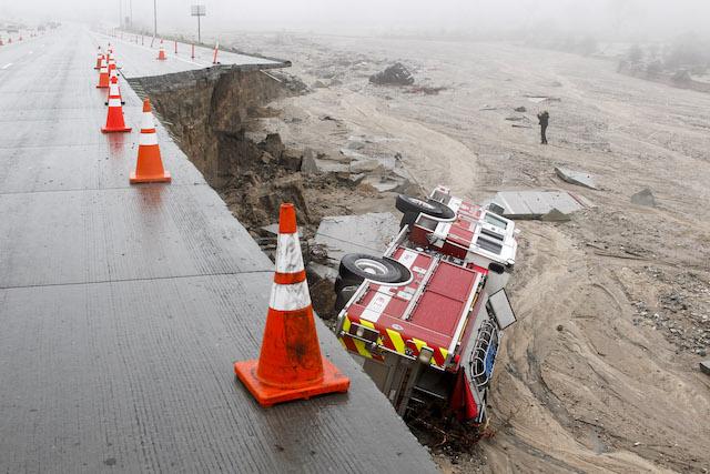A San Bernardino County fire truck plunged over the side of the southbound 15 freeway, just south of Highway 138, when a lane and shoulder caved in due to heavy rains in the Cajon Pass, on Saturday, Feb. 18, 2017. (Irfan Khan/Los Angeles Times/TNS)