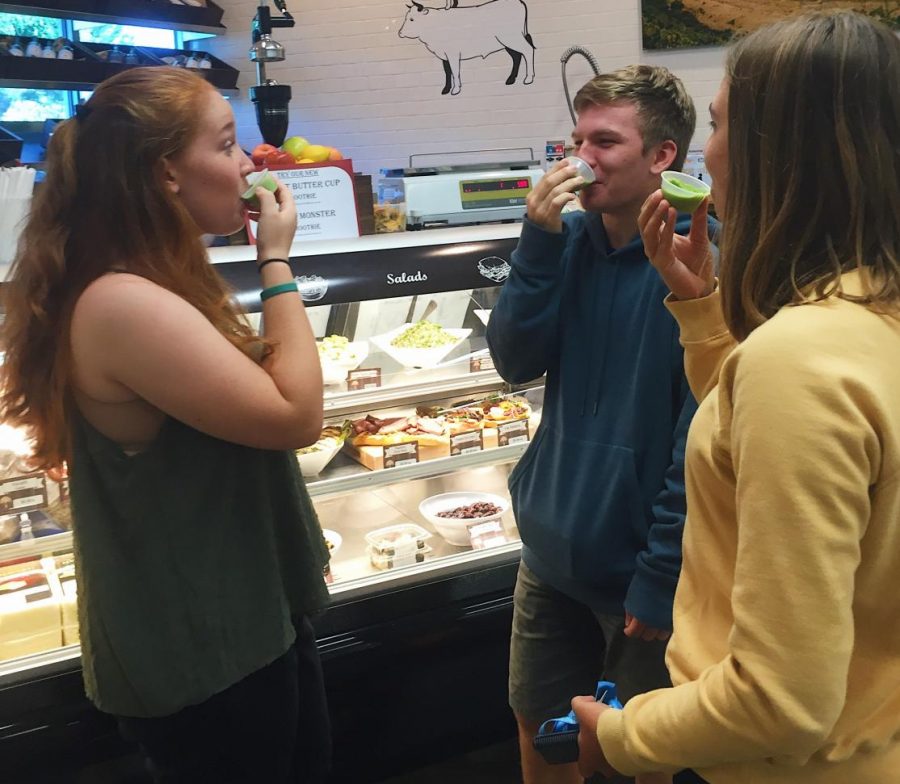 Students taste the drink offerings at the new market. 