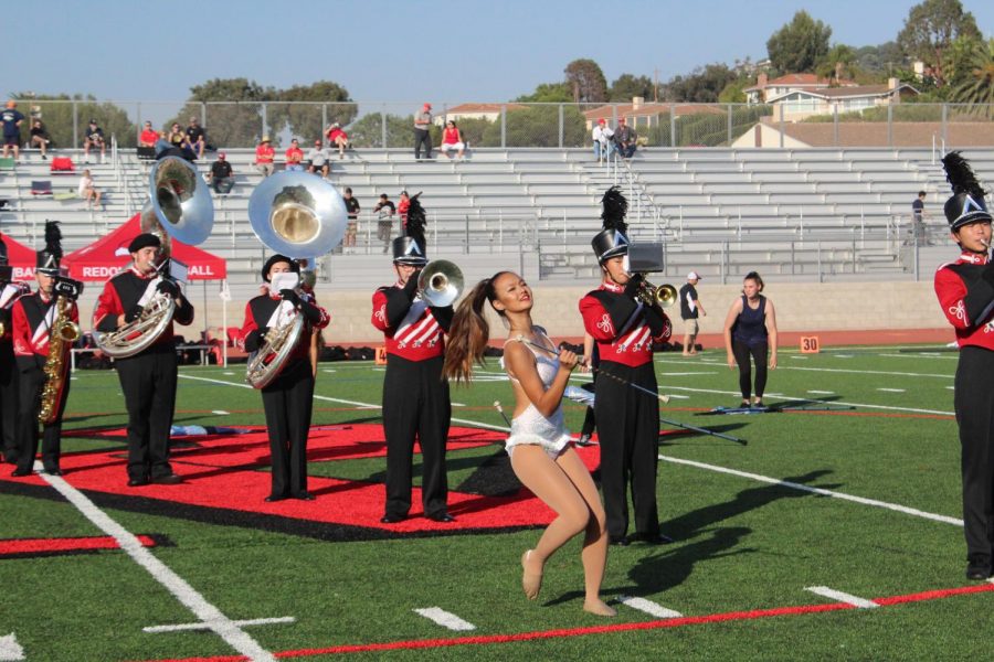 Molly Tamir performs with the marching band at the homecoming halftime show. 