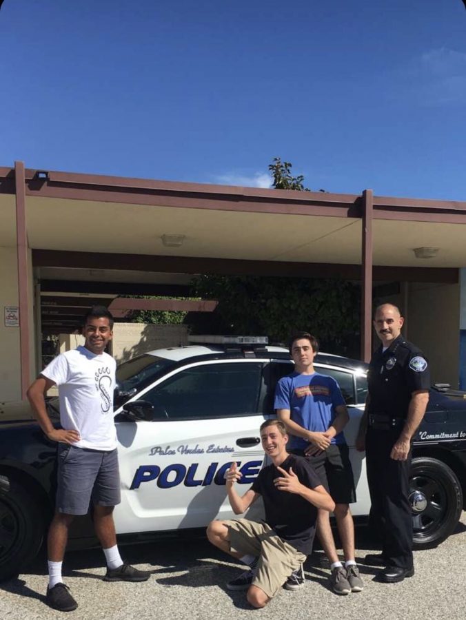 Members of the Student Chief Council (SCC), Pallav Chaturvedi, Lane Karlitz, and Johnny McKay, pose in front of Chief Velezs car. 