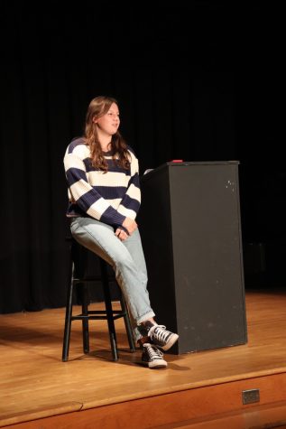 Sophomore Mia Dominguez delivers her poem at the Slam Poetry event on  March 22. (Photo courtesy of Grace Trester)