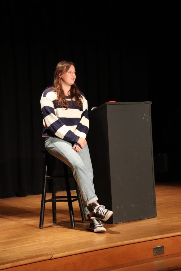 Sophomore Mia Dominguez delivers her poem at the Slam Poetry event on  March 22. (Photo courtesy of Grace Trester)