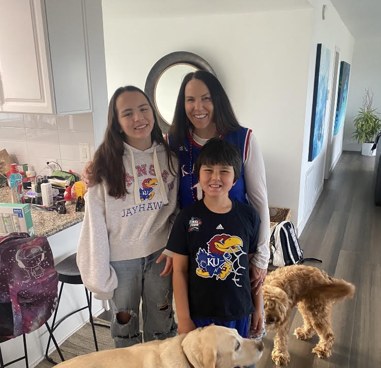 ASB Director Jama Maxfield and her children celebrate Kansas’s National Championship.(Photo courtesy of Jama Maxfield)